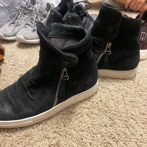 Black MizMooz sneakers.